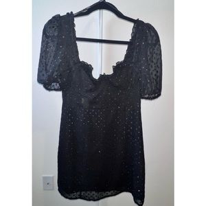 Beautiful dress in color black with sparkly circles.